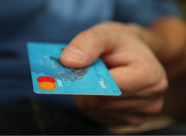 A man paying with a debit card
